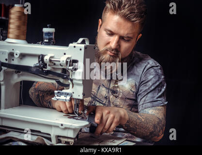 Handicraftsman being keen on his buisness Stock Photo