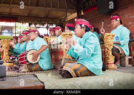 BALI, INDONESIA - APRIL 01: Musicians in the Gamelan troupe play traditional Balinese music to accompany dancers in a 'Barong Dance show' in Ubud vill Stock Photo