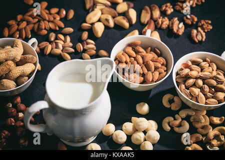 Milk from nuts on a black background Stock Photo