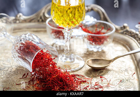 Saffron threads in an old tray Stock Photo