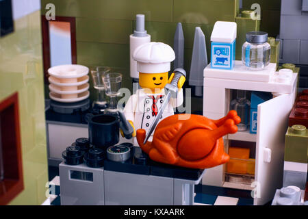 Tambov, Russian Federation - January 04, 2018 Lego chef cooking turkey in the kitchen. Studio shot. Stock Photo
