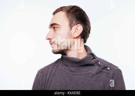 Side view of young bearded man isolated on gray Stock Photo