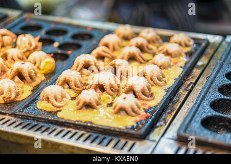 Making Takoyaki by big squid Floating market. Stock Photo