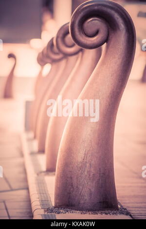 Wellington, New Zealand - 28 September 2015: Close up image of sylized Koru bollards between Civic Square and Wakefield Street. Stock Photo