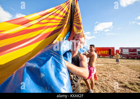 Members of Zavatta family removing big top of circus tent, Zavatta Circus, Kerroch, Morbihan, Brittany, France Stock Photo