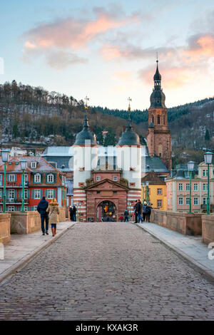 Karl Theodor Bridge (German: Karl-Theodor-Brucke), commonly known as the Old Bridge (German: Alte Brucke), is a stone bridge in Heidelberg, crossing the Neckar River. It connects the Old City with the eastern part of the Neuenheim district of the city on the opposite bank. The current bridge, made of Neckar Valley Sandstone and the ninth built on the site, was constructed in 1788 by Elector Charles Theodore, and is one of the best-known and amazing landmarks and tourist destinations in the history of Heidelberg, Baden-Wurttemberg, Germany Stock Photo