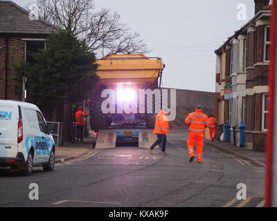 Sheerness, Kent, UK. 8th Jan, 2018. The unusual sight of a giant dumper truck being unloaded, briefly blocking Marine Parade in Sheerness. The Bell articulated dump truck is being used for sea defense work being undertaken by the Environment Agency to move large volumes of shingle. Credit: James Bell/Alamy Live News Stock Photo