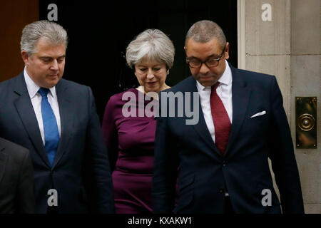 London, UK. 8th Jan, 2018. British Prime Minister Theresa May (C) walks out of 10 Downing street with Conservative Party Chairman Brandon Lewis (L) and Conservative Party Deputy Chairman James Cleverly (R) as she announces new ministerial appointments to her front bench in a Cabinet reshuffle beginning today, in London, Britain on Jan. 8, 2018. Credit: Tim Ireland/Xinhua/Alamy Live News Stock Photo