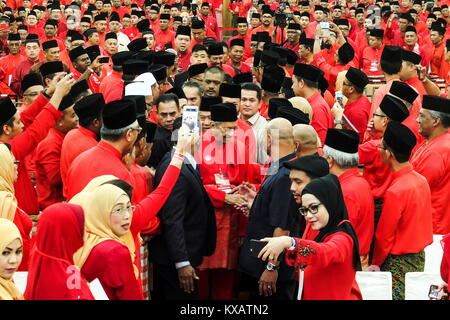 SHAH ALAM, MALAYSIA - DECEMBER 23: Former Malaysian Prime Minister and Opposition Malaysian United Indigenous Party (PPBM) chairman, Mahathir Mohamad shake hand with his supporters during first annual general assembly meeting in Shah Alam outside Kuala Lumpur on December 30, 2017. The government's mandate through the 13th general election will end June next year and the 14th general election must be held within 60 days from that date. The Malaysian United Indigenous Party (PPBM) it is one of the four component parties of the opposition coalition in Malaysia called the Pakatan Harapan has been Stock Photo