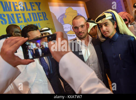 Doha, Qatar. 8th Jan, 2018. Wesley Sneijder (2nd R) of the Netherlands poses for photo with fans after a press conference in Doha, Qatar, Jan. 8, 2018. Wesley Sneijder has signed an 18-month contract with Qatari club Al-Gharafa. Credit: Nikku/Xinhua/Alamy Live News Stock Photo