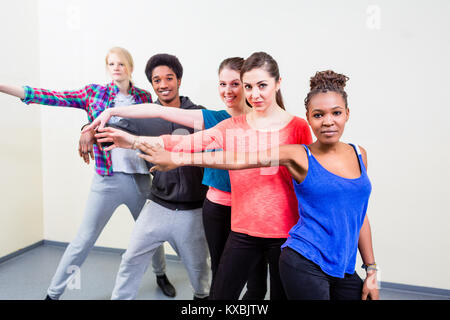 Group of young people having dance lessons Stock Photo