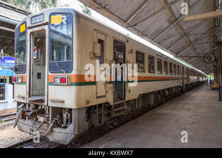 Commuter train and few people at the Central railway station in Yangon, Myanmar (Burma). Stock Photo