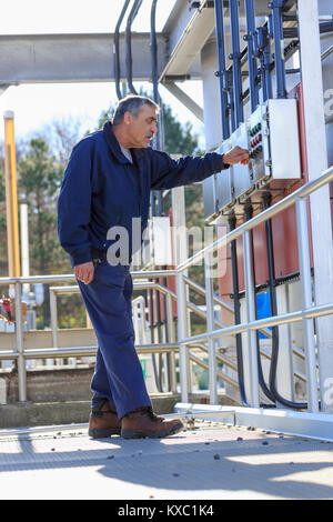 Engineer at water treatment control panel Stock Photo