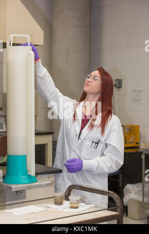 Lab chemist preparing to test samples Stock Photo