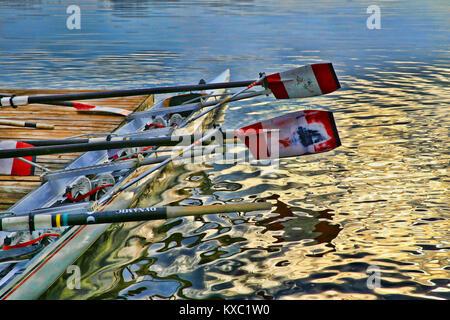 Rowing shell at side of Jetty. Stock Photo