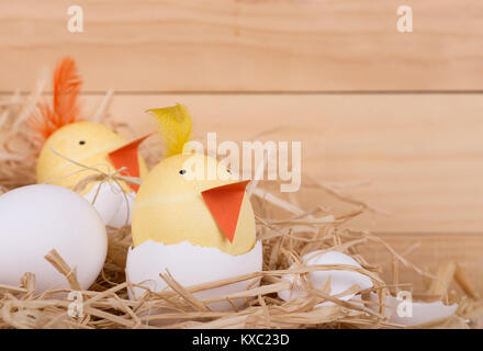 Two Easter eggs decorated as hatching chicks Stock Photo