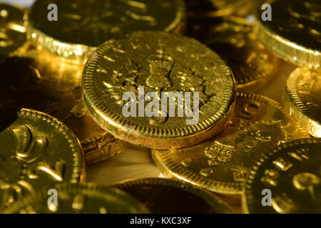 Chocolate coins wrapped in gold foil, a traditional British Christmas gift Stock Photo