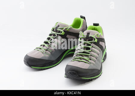 Outdoors shoes for man for different activities, trail running, freerunning, fast climbing, hiking, studio shoot on white background Stock Photo