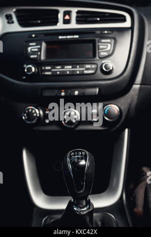 close up of gear shift in the car and central console in the background Stock Photo