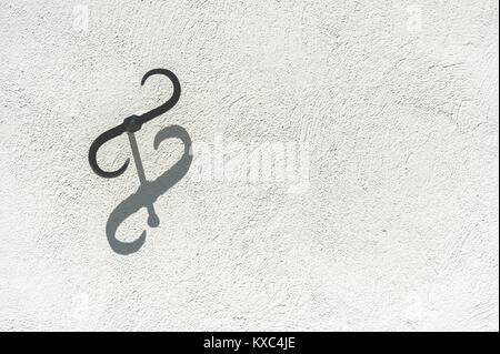 double hook on white wall Stock Photo