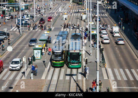 FINLAND, HELSINKI, JUL 02 2017, trams are standing on the main street beside main railway station at Helsinki (Helsingin Rautatieasema), Finland. Outs Stock Photo