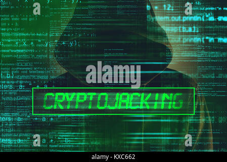 Cryptojacking concept, computer hacker with hoodie and lines of script code overlaying image Stock Photo