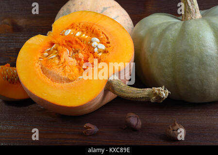 Fresh pumpkin on wooden background closeup Stock Photo
