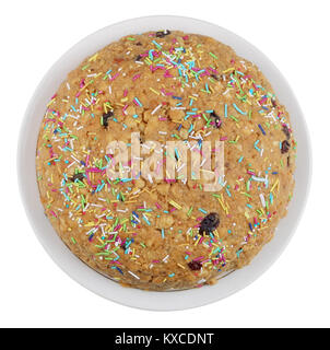 A sweet round cake with the popular name 'Anthill' on plate. Top view isolated on white Stock Photo