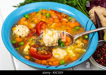 Chicken broth with vegetables and meatballs Stock Photo