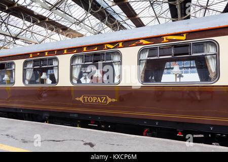 A preserved Pullman carriage is pictured in Carlisle Citadel station in Cumbria.  Pullman was a luxury railway service that operated in Great Britain. Stock Photo