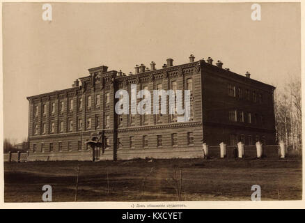 A cropped photograph showing a student dormitory building, featuring Soviet-era residential architecture and structural design elements. Stock Photo
