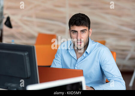Freelance programmer working in startup office Stock Photo