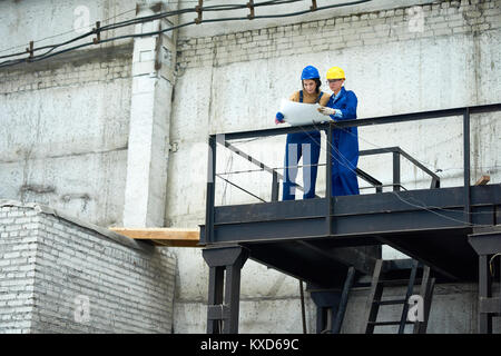 Two Construction Engineers Working at Plant Stock Photo