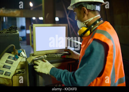 Operating CNC Machine Stock Photo