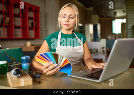 Professional Artist Working in Workshop Stock Photo