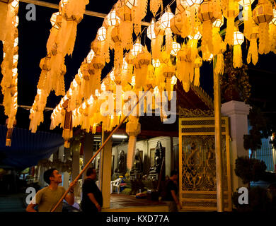 Lamphun, Thailand - October 27, 2017: Buddhist decorating Yee Peng lantern in Wat Phra That Hariphunchai Stock Photo