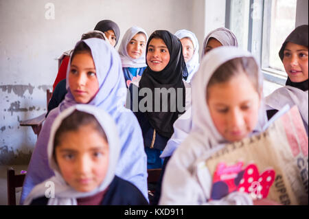 SKARDU, PAKISTAN - APRIL 17: An unidentified Children in village in the south of Skardu are learning in classroom of the village school April 17, 2015 Stock Photo