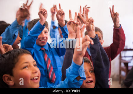 SKARDU, PAKISTAN - APRIL 17: An unidentified Children in village in the south of Skardu are learning in classroom of the village school April 17, 2015 Stock Photo