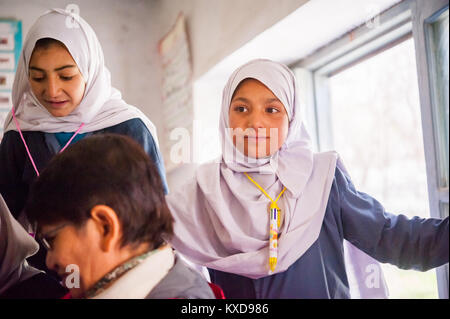 SKARDU, PAKISTAN - APRIL 17: An unidentified Children in village in the south of Skardu are learning in classroom of the village school April 17, 2015 Stock Photo