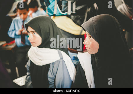 SKARDU, PAKISTAN - APRIL 17: An unidentified Children in village in the south of Skardu are learning in classroom of the village school April 17, 2015 Stock Photo