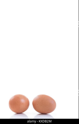 Two Raw eggs isolated on white background Stock Photo