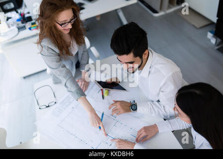 Group of architects working together on project Stock Photo