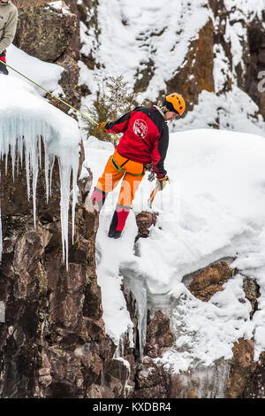 Ice climber balancing on edge of climb, Ouray Ice Park, Colorado, USA Stock Photo