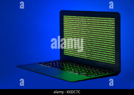 Symbol image cybercrime,laptop with digital binary code Stock Photo