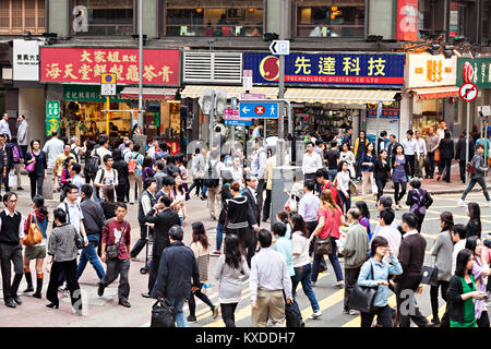 HONG KONG - MARCH 19: Unidentified people near Wan Chai metro station on March, 19, 2013. Wan Chai metro station is a one of the most busy in HK. Stock Photo