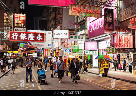 HONG KONG - MARCH 19: Neon lights on Mongkok street on March, 19, 2013. Mongkok street is a very popular shopping place in Hong Kong. Stock Photo
