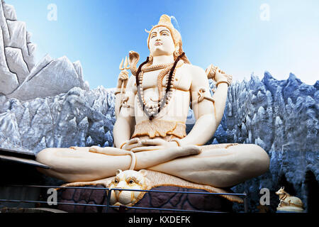 BANGALORE, INDIA - MARCH 27: Big Lord Shiva statue sitting in lotus with trident on March 27, 2012 in Bangalore, India. This Shiva Statue is highest i Stock Photo