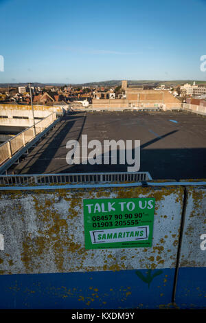 Samaritans notice on a multi-storey car park in Worthing town centre, West Sussex, UK Stock Photo