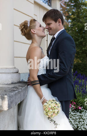 Young bridal couple in enamoured pose, Switzerland Stock Photo