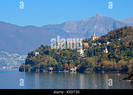 The town Pino sulla Sponda del Lago Maggiore and peak Pizzo di Vogorno, Lombardy, Italy Stock Photo